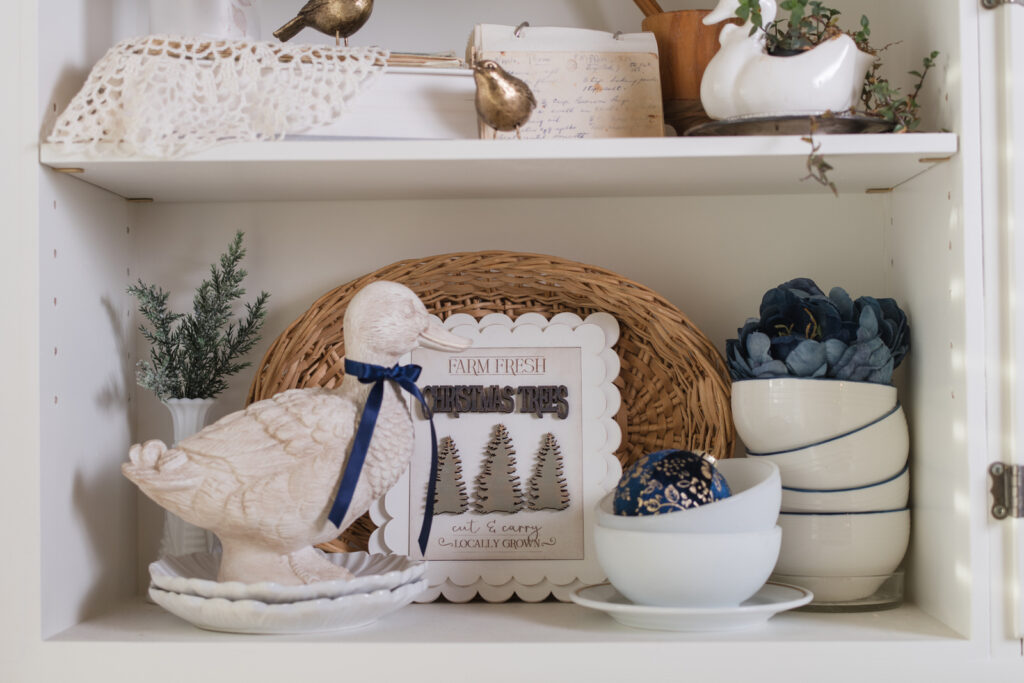 Every day decor made festive by adding a bow to a duck that is decorated year-round in the kitchen