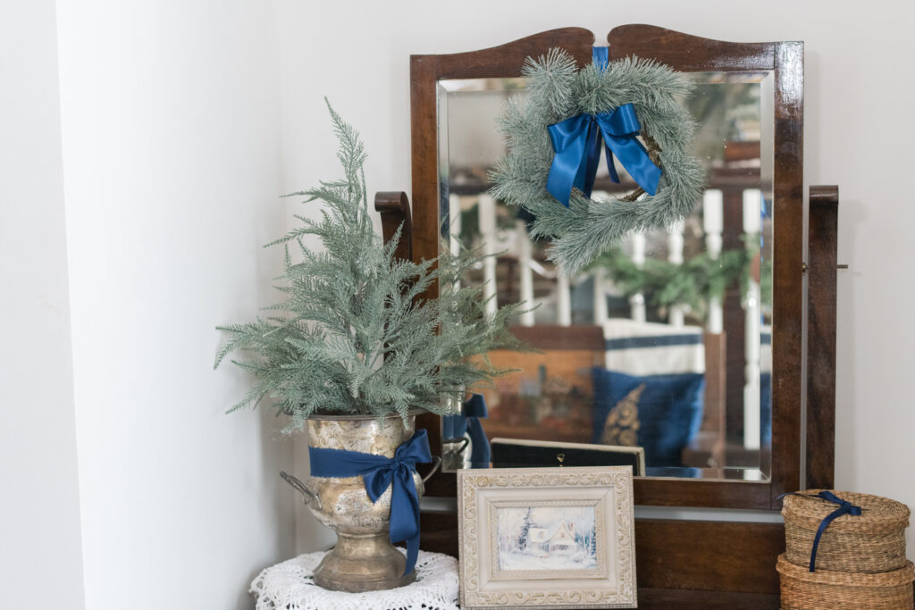 Vintage dresser in a front entrance styled for Christmas
