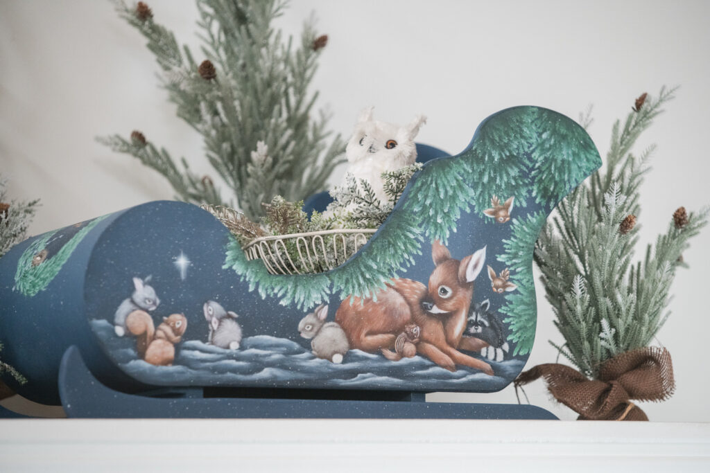 Hand painted sleigh for Christmas with woodland animal scene