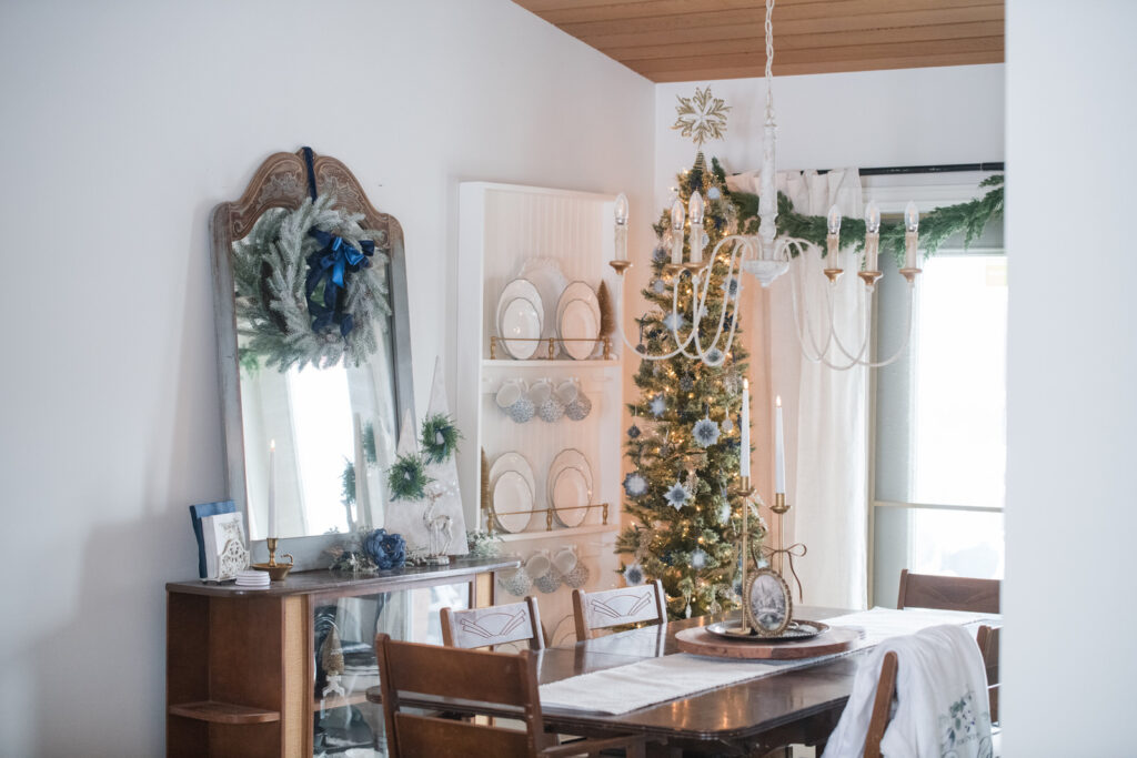 Christmas dining room decorated with blue gold and white. Full of DIY Christmas crafts. 