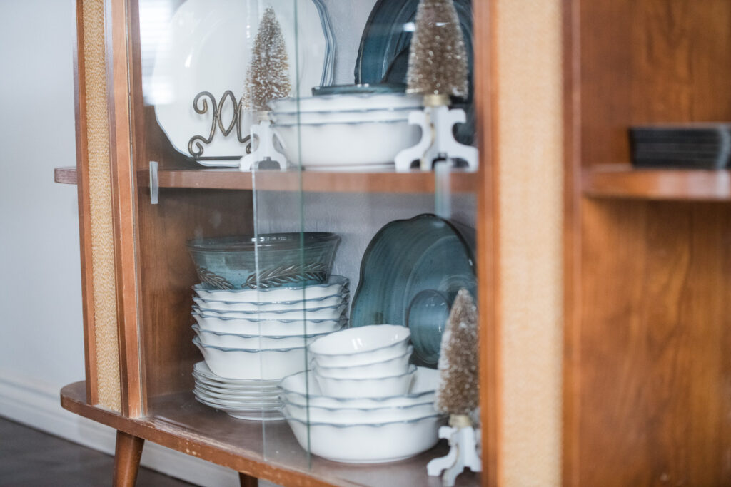 China cabinet with white and blue dishes