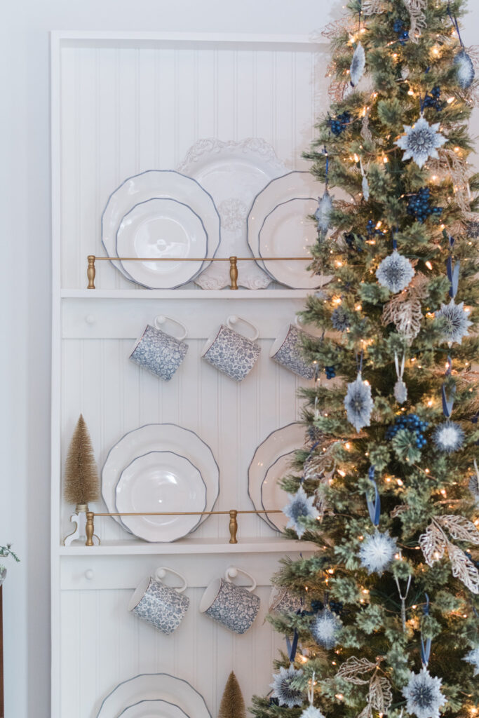 Bottle brush trees displayed in the dining room plate rail 