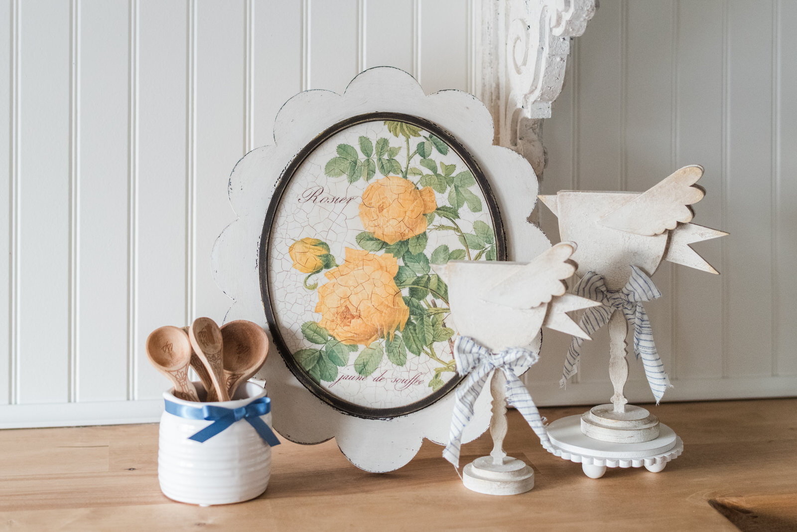 Vintage-inspired cottage decor DIY with spindle birds and scallop frame
