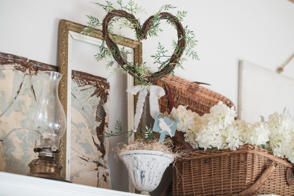 Textured watering can finished with salt wash and milk paint