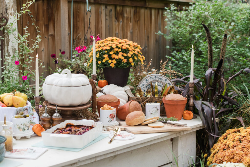 Fall harvest Buffet with terracotta pot sage bread styled on an outdoor buffet 