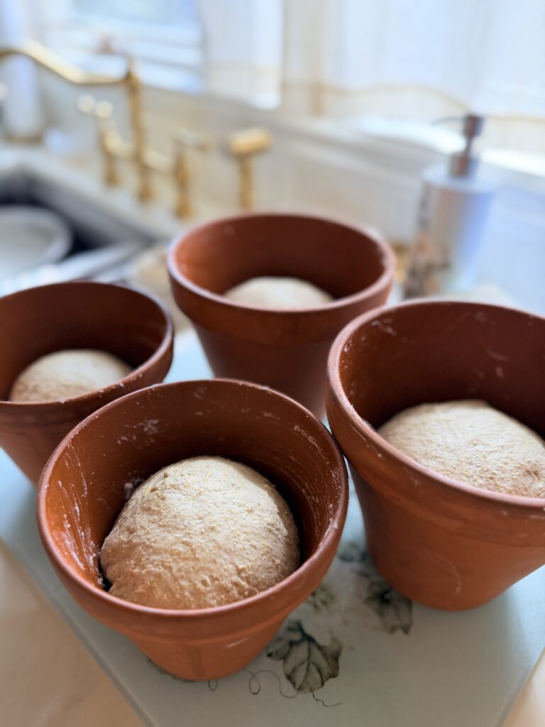 Old Homestead Sage Bread dough rising in terracotta pots before baking