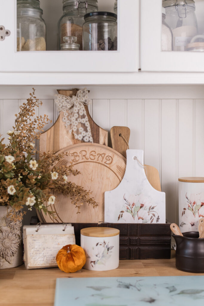 Fall cutting board displayed in an antique sewing machine drawer, cottage kitchen styling