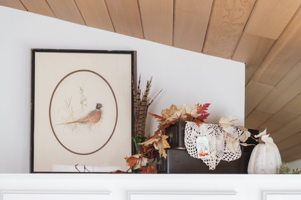 Vintage pheasant, print styled beside sewing machine, drawers, repurposed with lace and autumn greenery with pheasant feathers