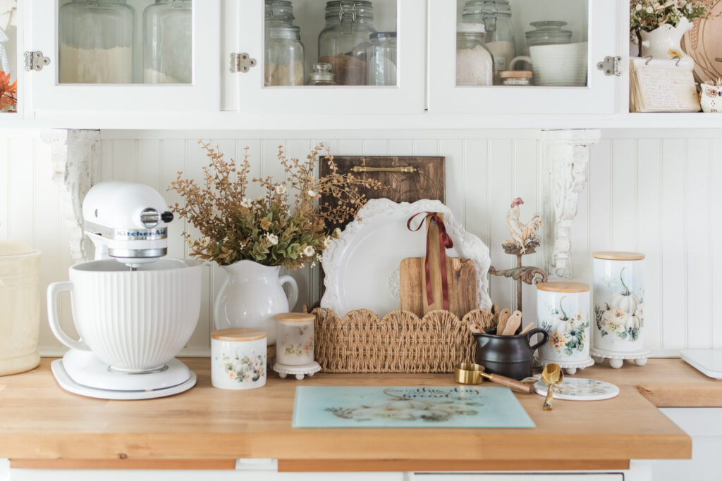 Close-up of Vintage Autumn canisters and layered cutting boards