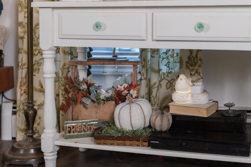 Autumn decor under the TV stand in the family room
