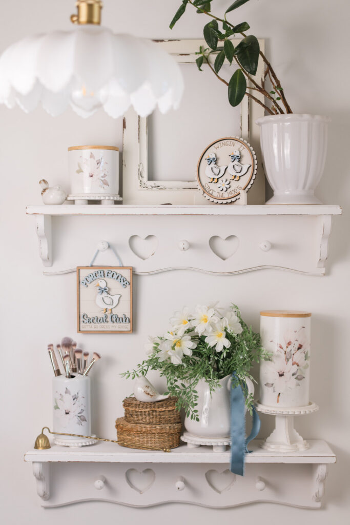 Magnolia canisters styled for summer in a guest bathroom