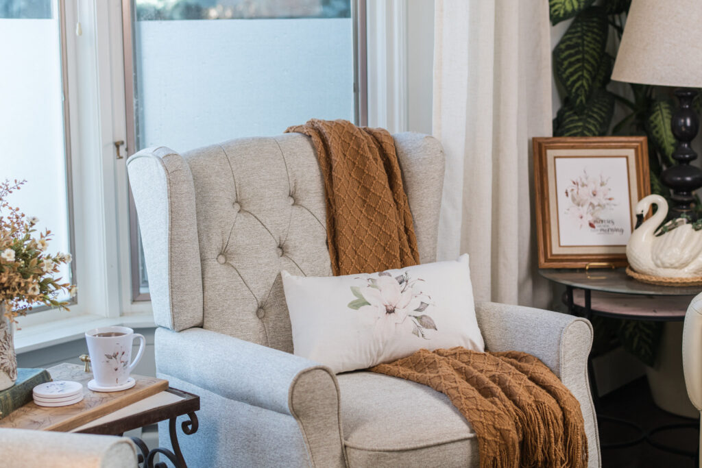 Magnolia pillows styled for autumn in a cottage living room