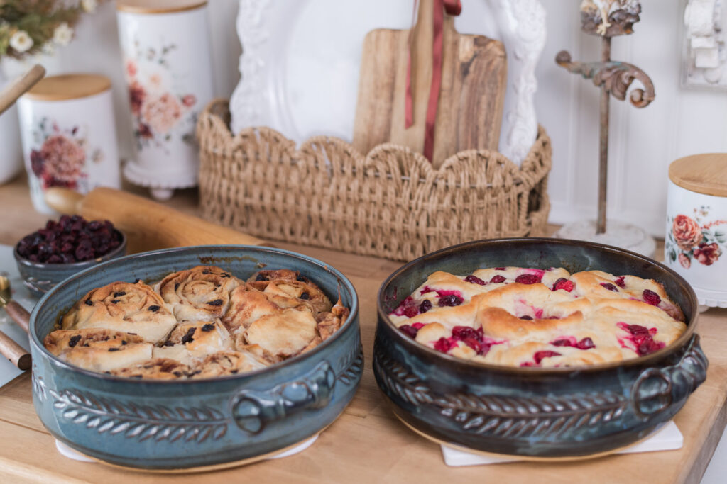 Desserts cooling in blue handmade pottery on a butcher block